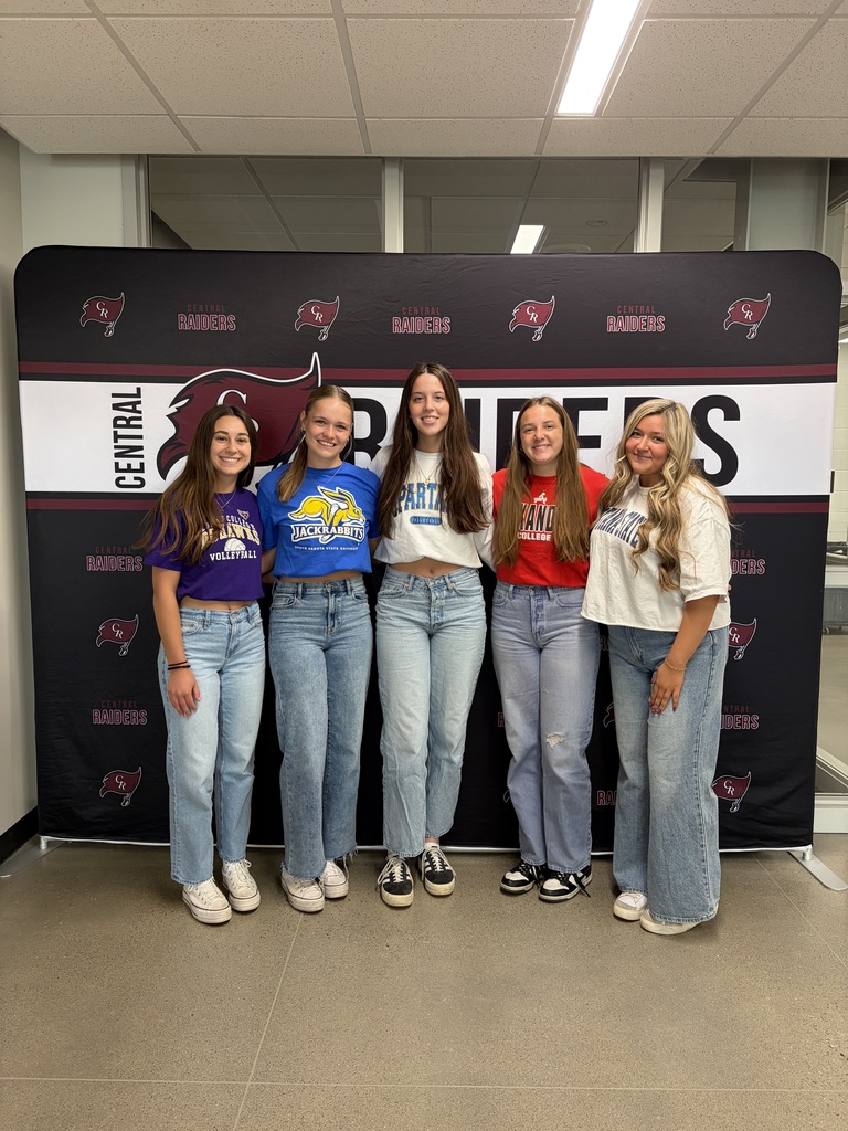 students wearing college shirts on decision day