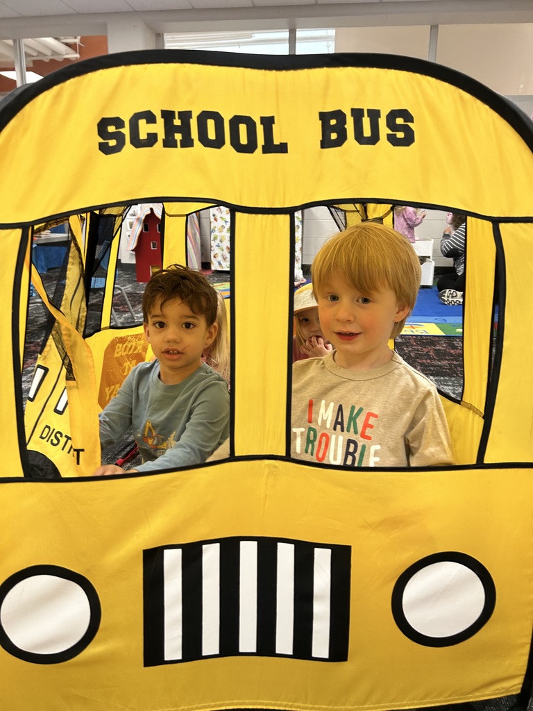 preschoolers playing in pop up bus