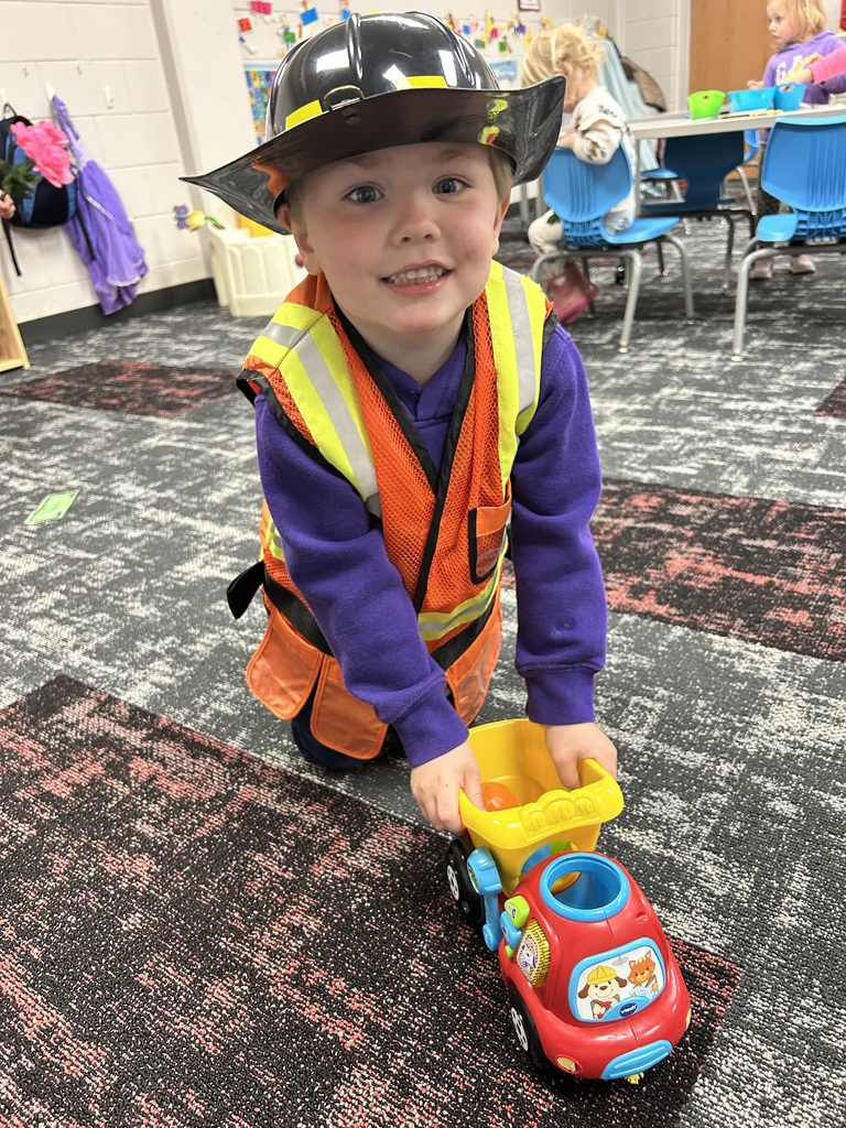 preschooler playing dress up