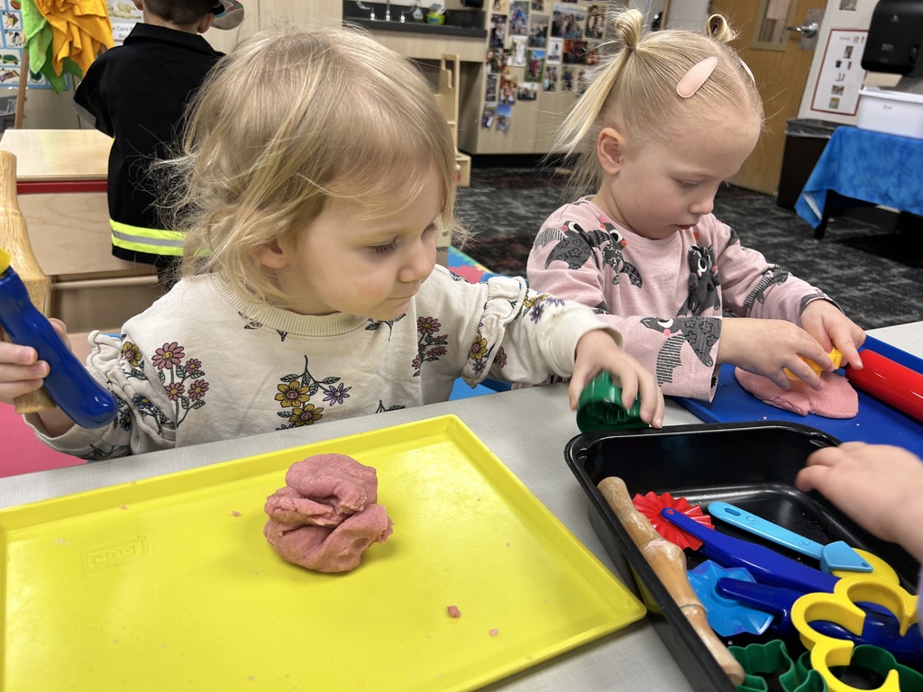 preschooler playing with playdoh