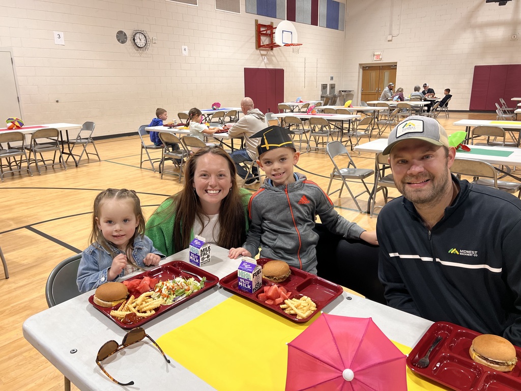 kindergarten students with their family at school