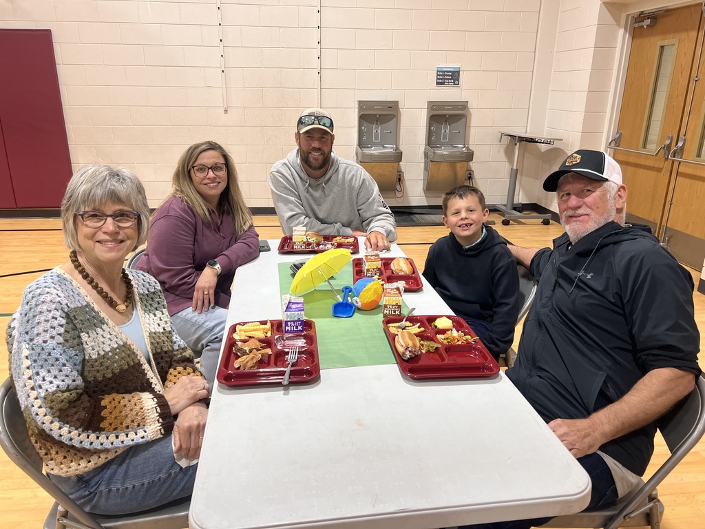 kindergarten students with their family at school