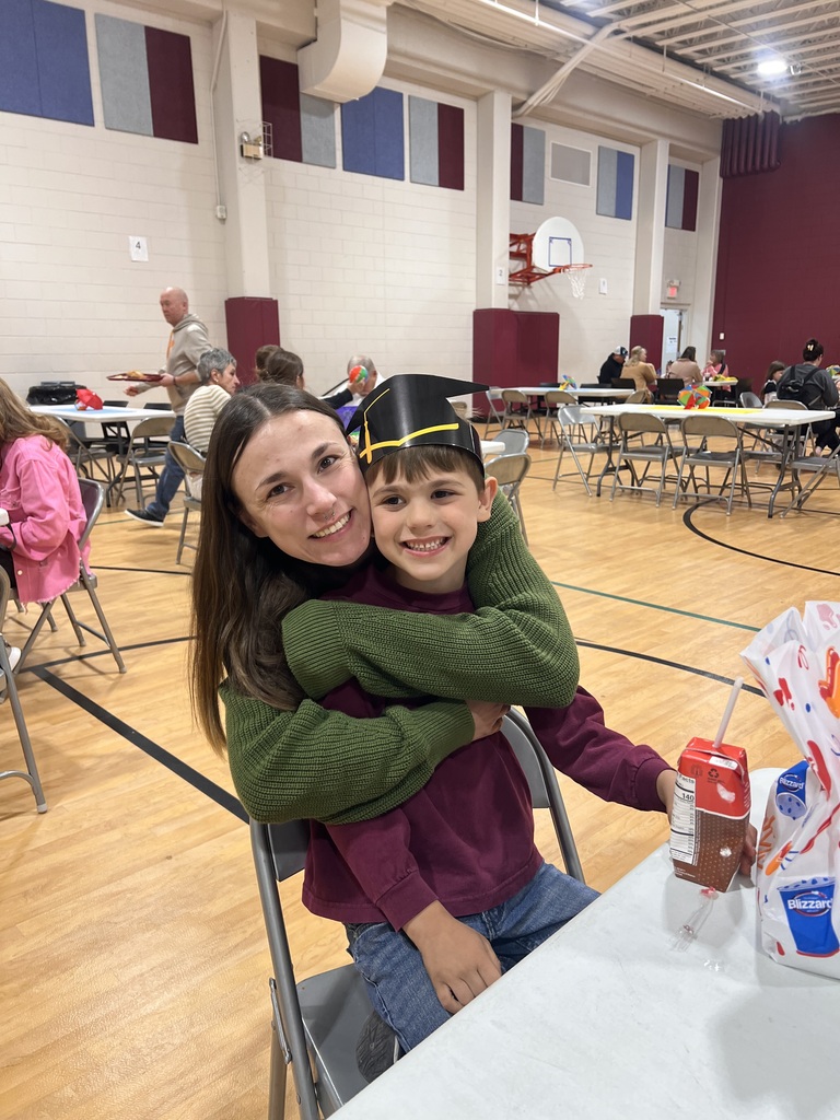 kindergarten students with their family at school