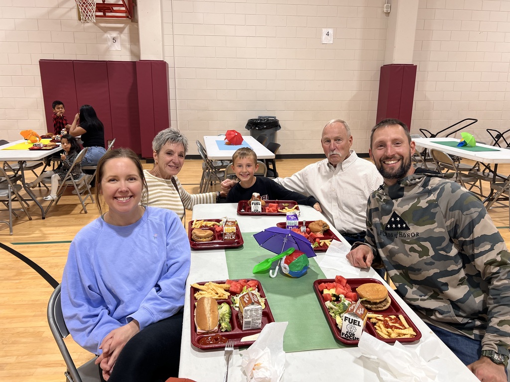 kindergarten students with their family at school