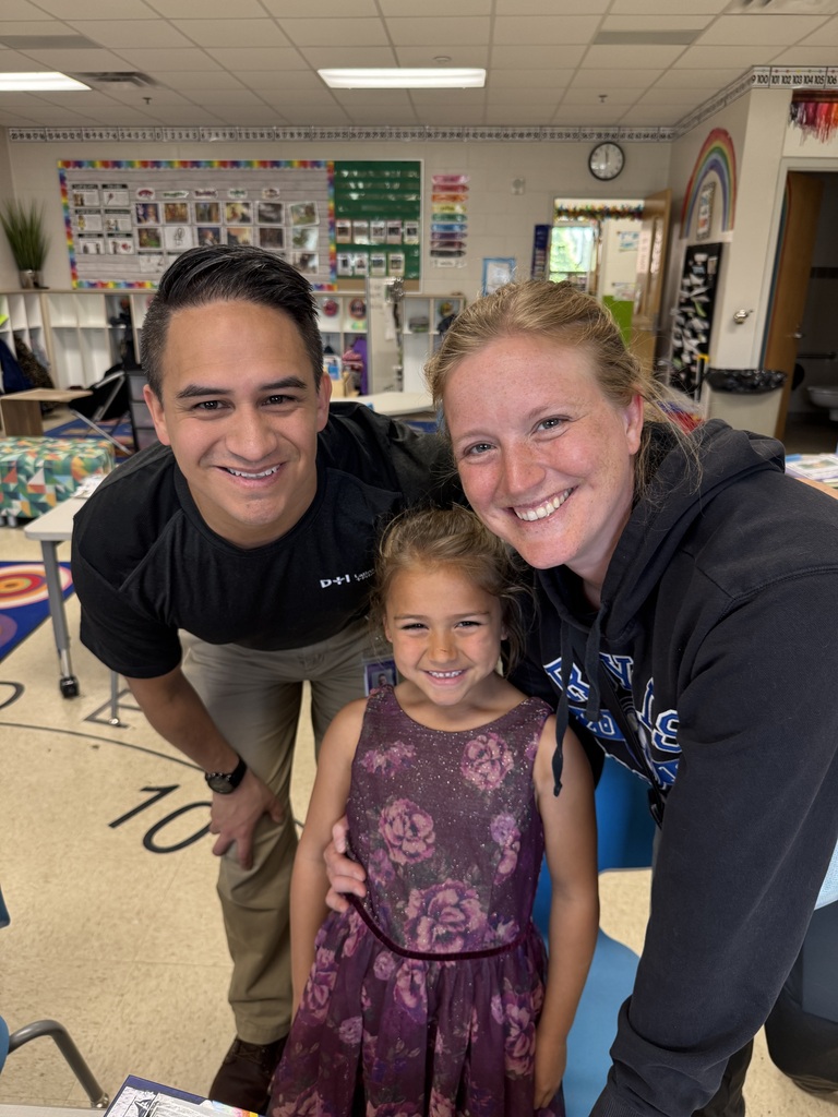 first grade students with families at school