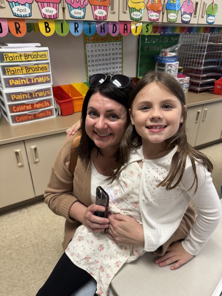 first grade students with families at school