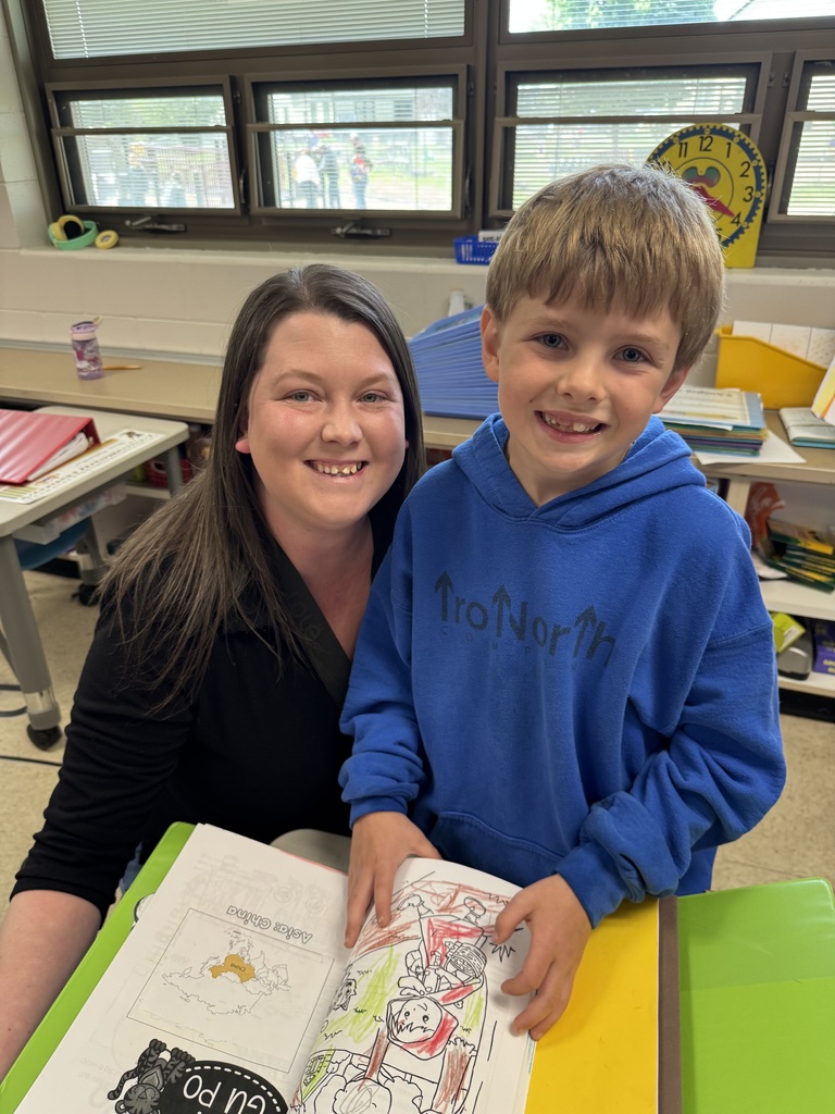 first grade students with families at school
