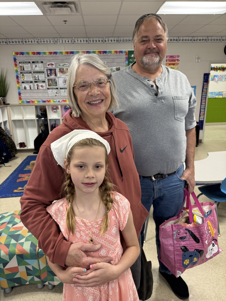 first grade students with families at school