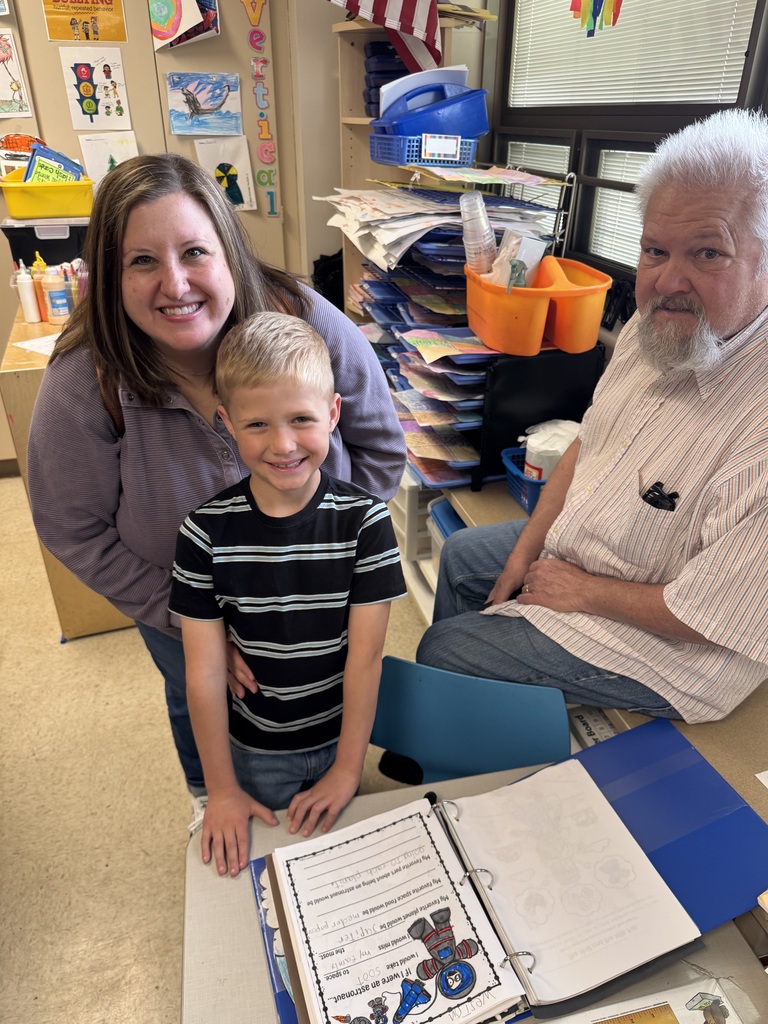 first grade students with families at school