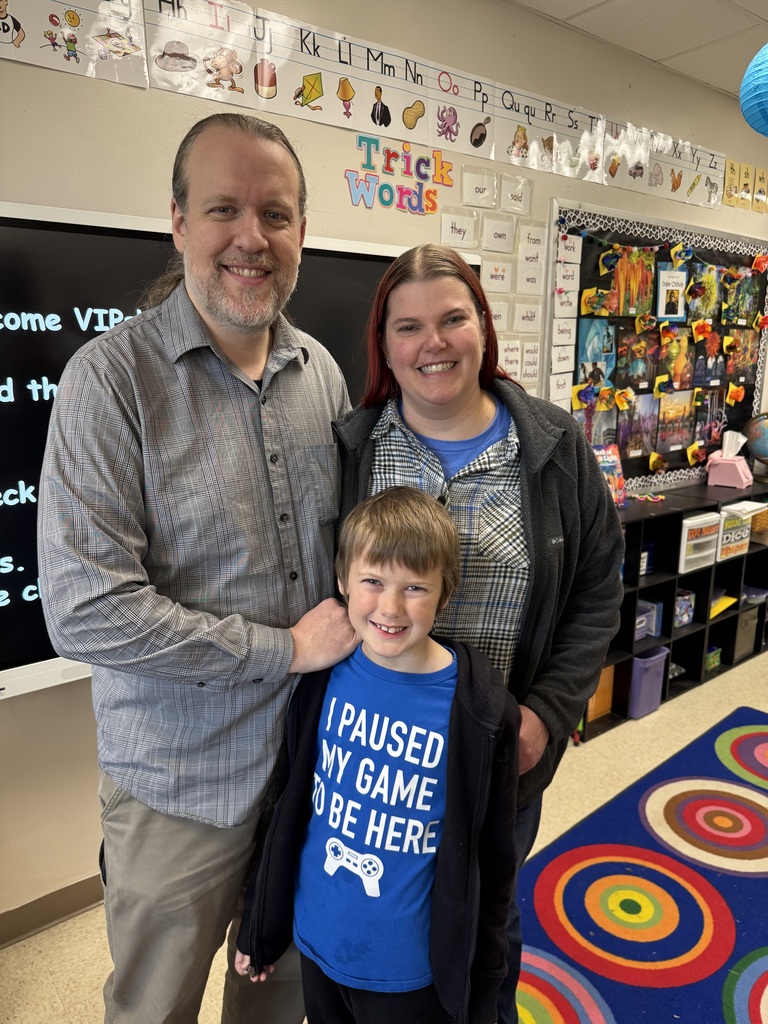 first grade students with families at school