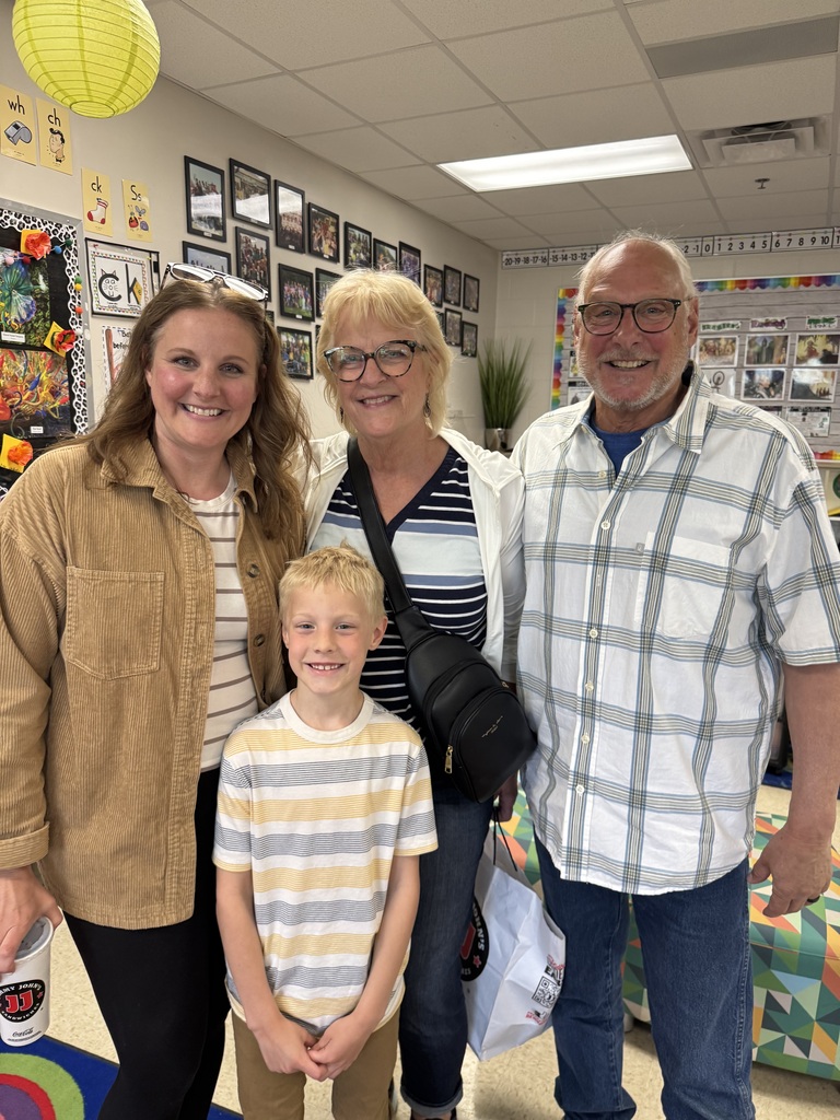 first grade students with families at school