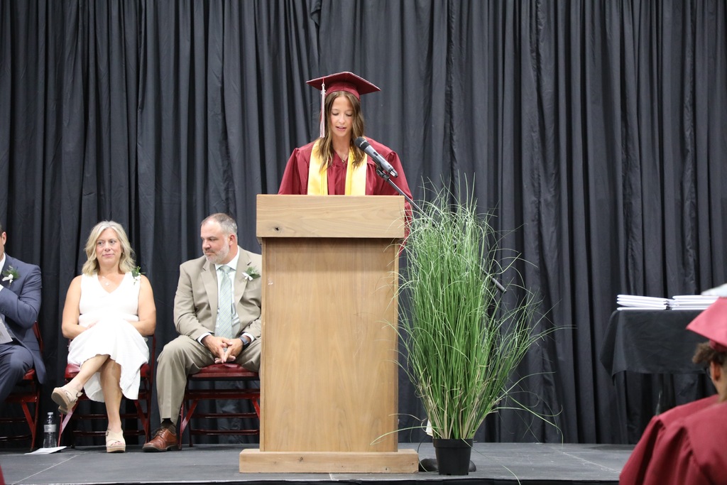 senior speaking at podium