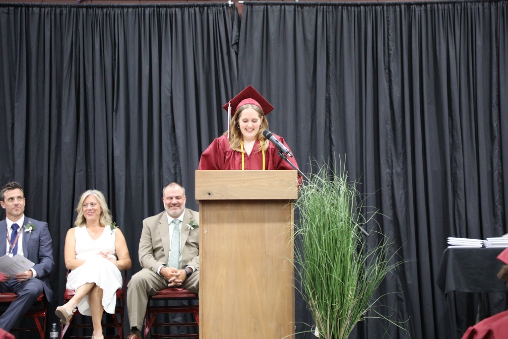 senior speaking at podium