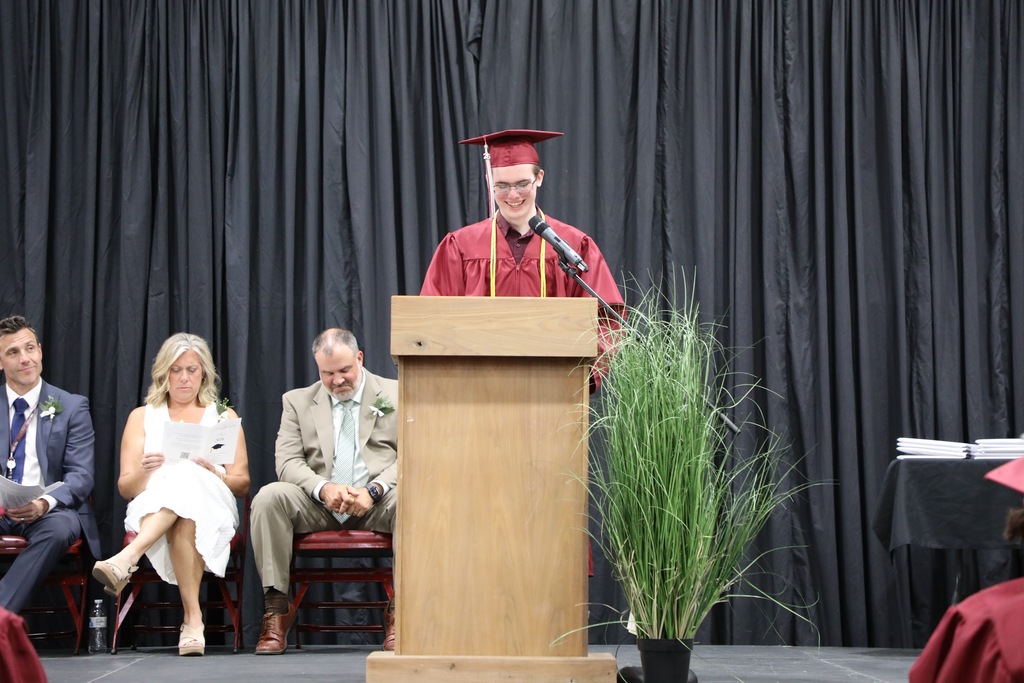 senior speaking at podium