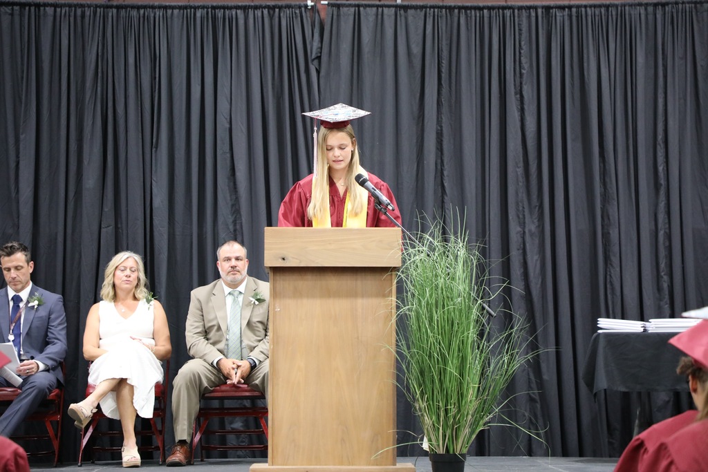 senior speaking at podium