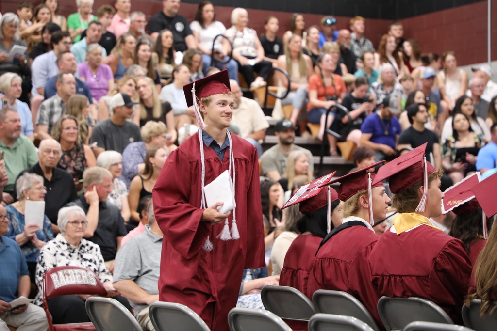 student walking to stage at graduation