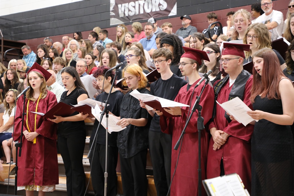 students singing at graduation