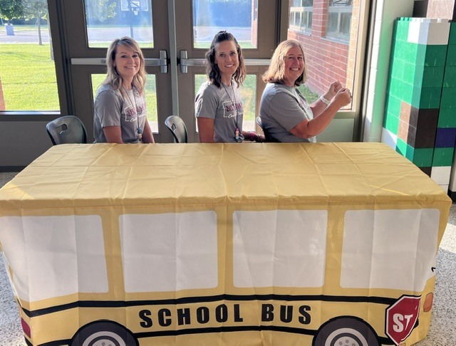 kindergarten team driving pretend school bus