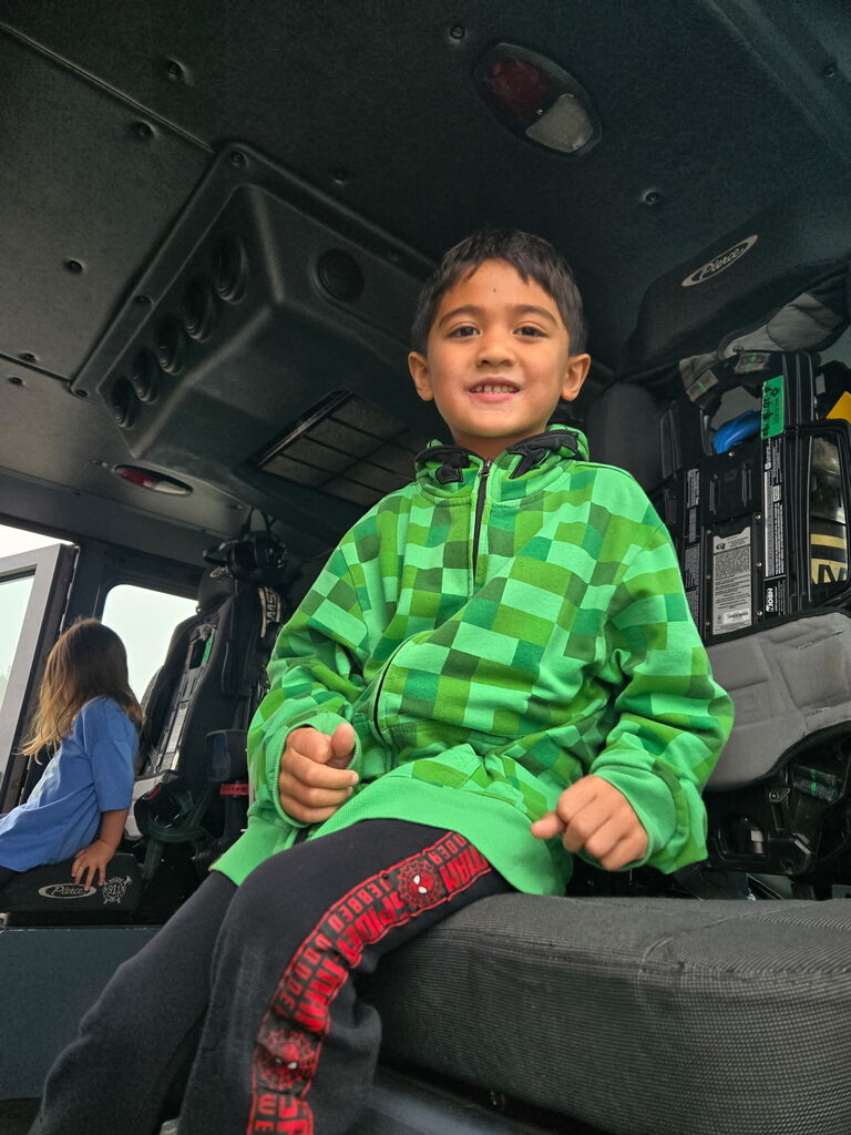 preschoolers sitting in fire truck
