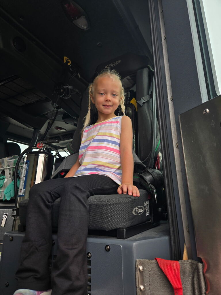 preschoolers sitting in fire truck