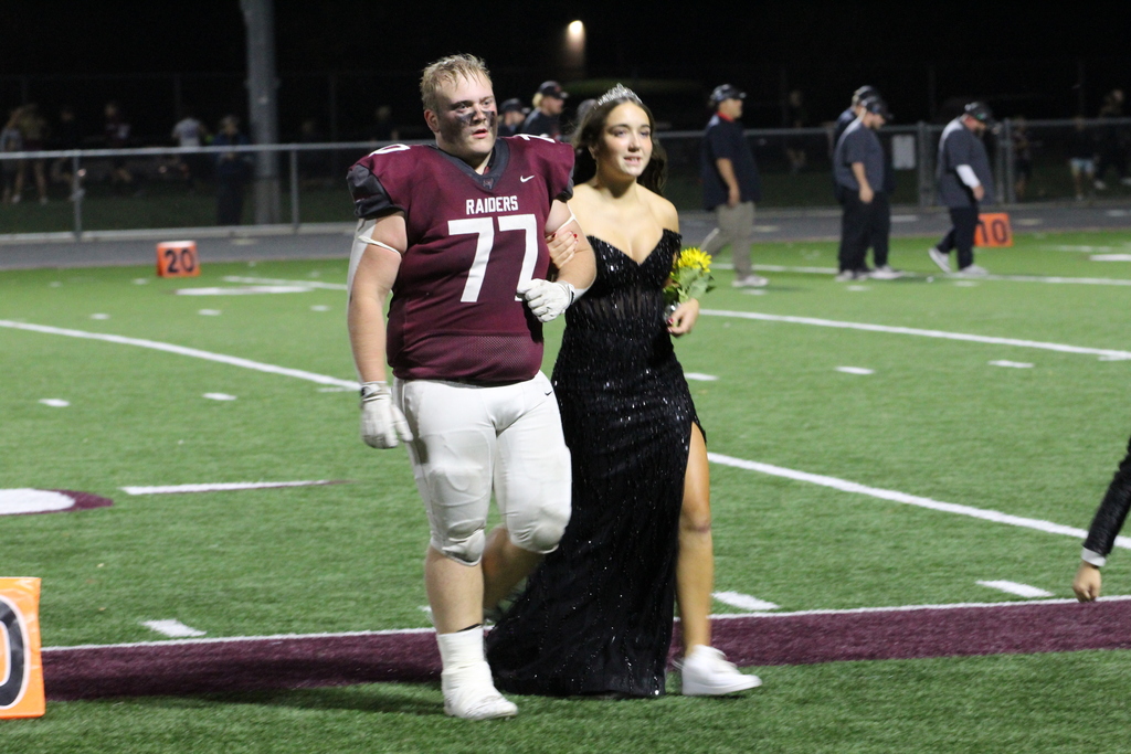 homecoming court on football field
