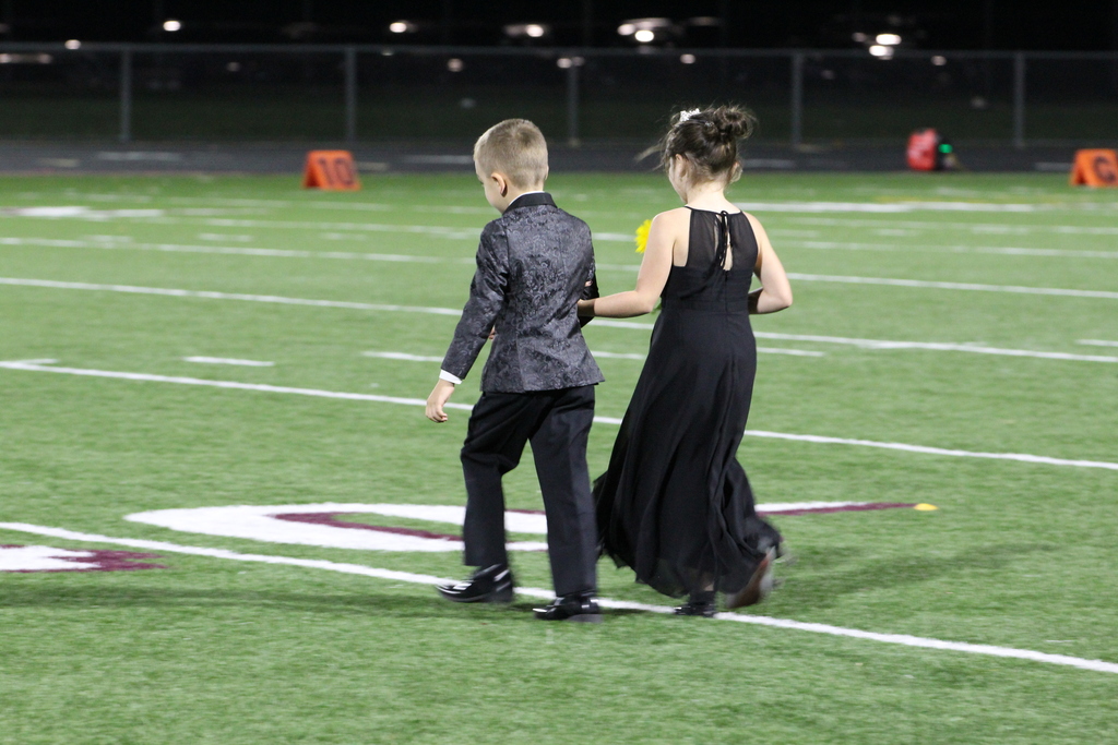 homecoming court on football field