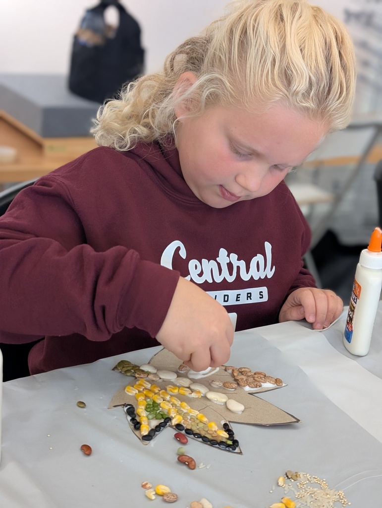 student creating fall leaf mosaic