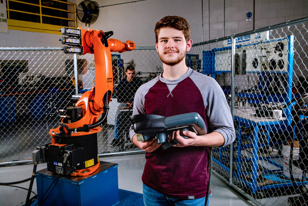 teen boy operating an electromechanical arm1