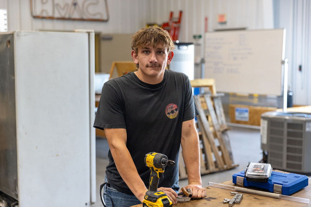 student at Central Tech stands in the HVAC classroom
