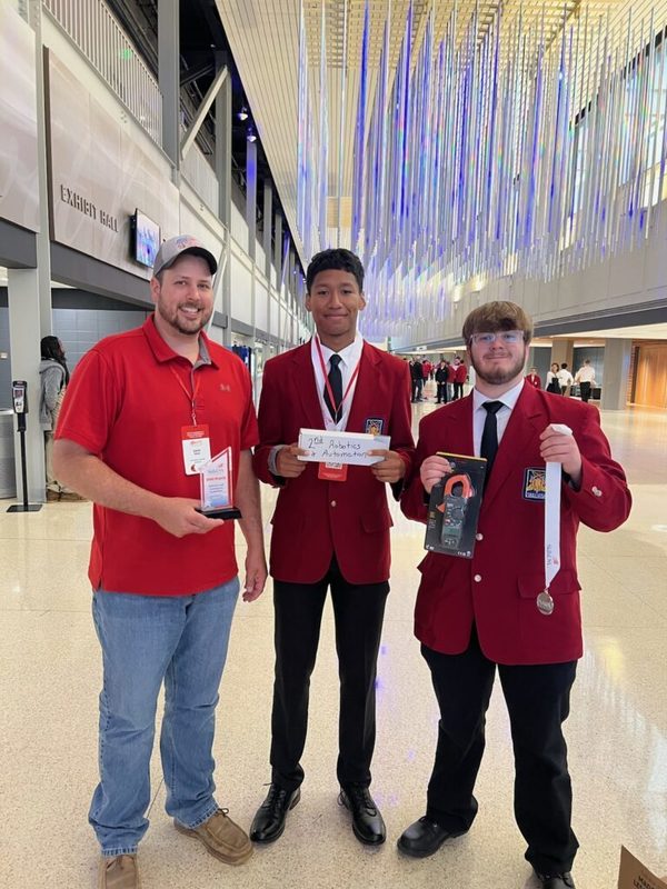 Students holding awards
