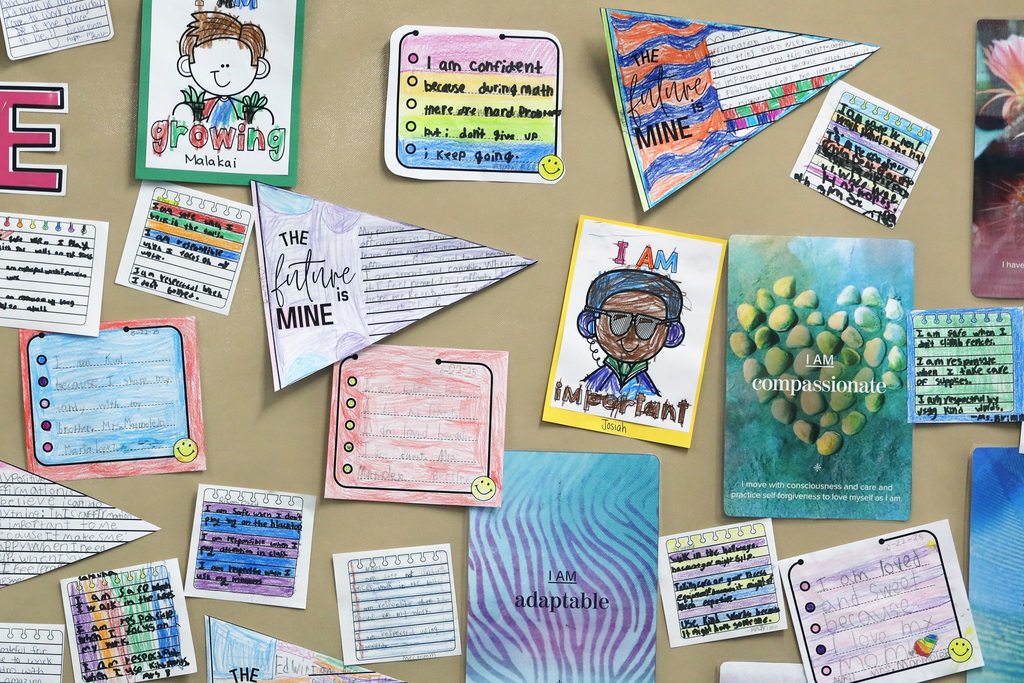 Writing wall with student art and writings