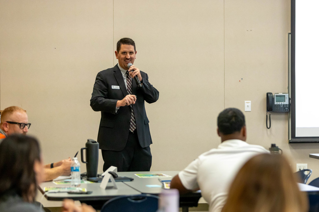 man presenting to a crowd