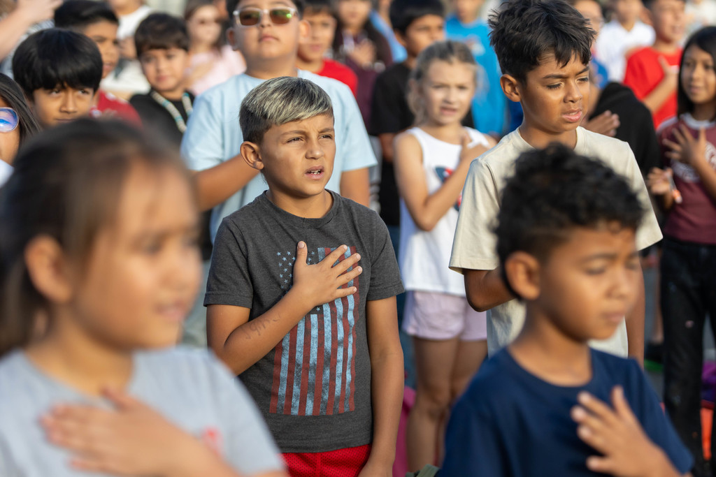 student saying the Pledge of allegiance 