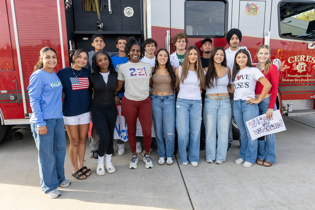group of students and staff posing for a photo