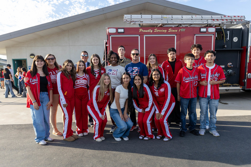 group of students and staff posing for a photo