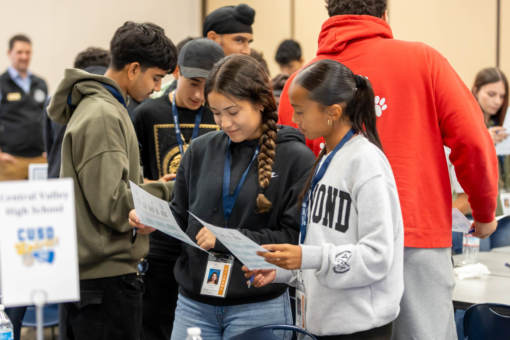 students looking a work sheet