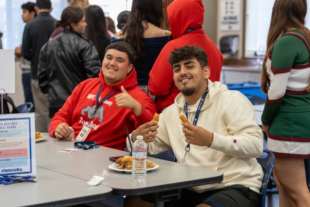 students giving a thumbs up