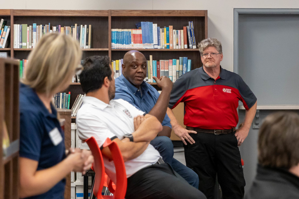 a group of adults talking 
