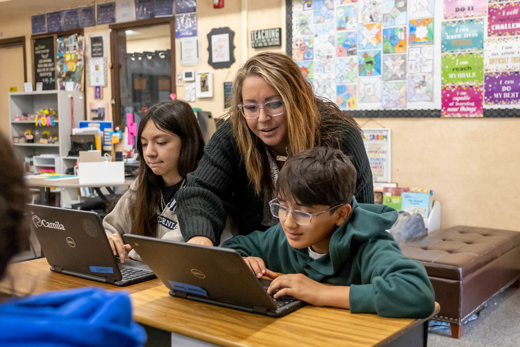 teacher helping student