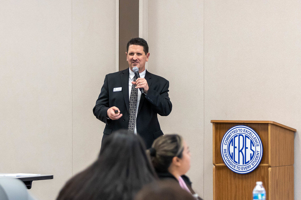 Man speaking to a group of people