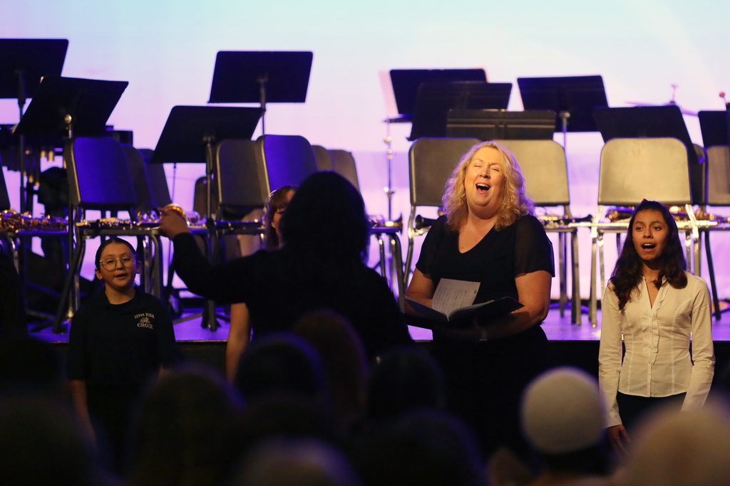 Principal sings with choir students
