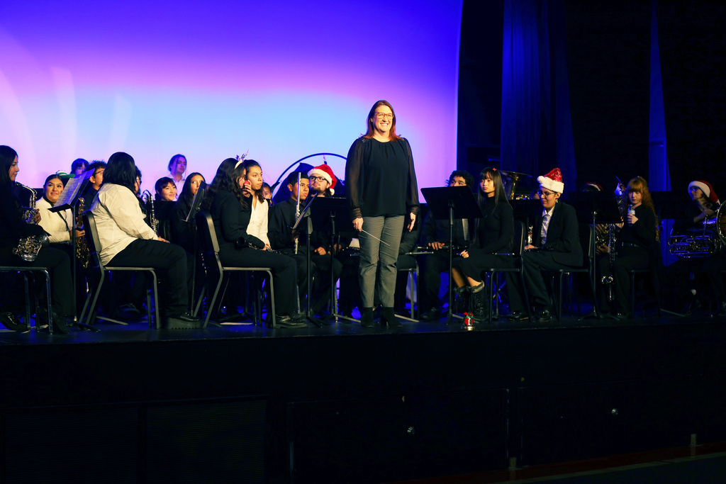 Superintendent on stage with band students