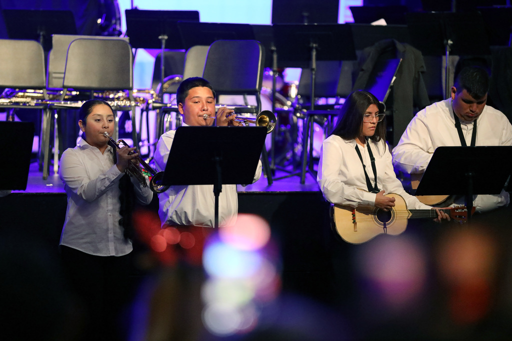 Mariachi members perform