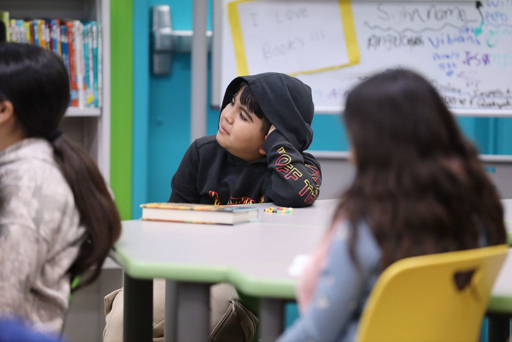 Student listening to story being read