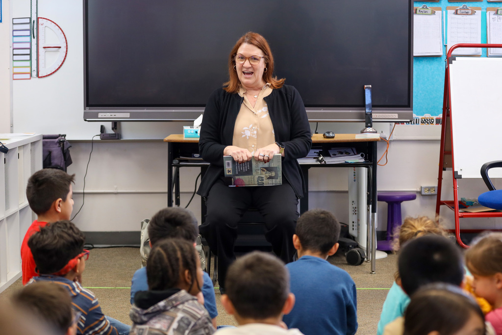 Dr. Peterman reads to students