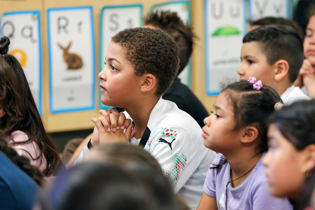 Students listen intently