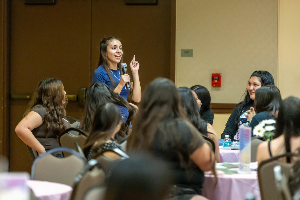 Student talking to a crowd