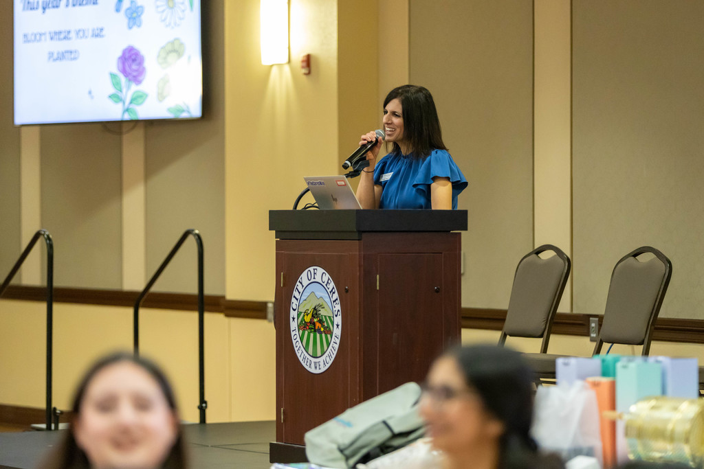 Adult talking to a crowd of students