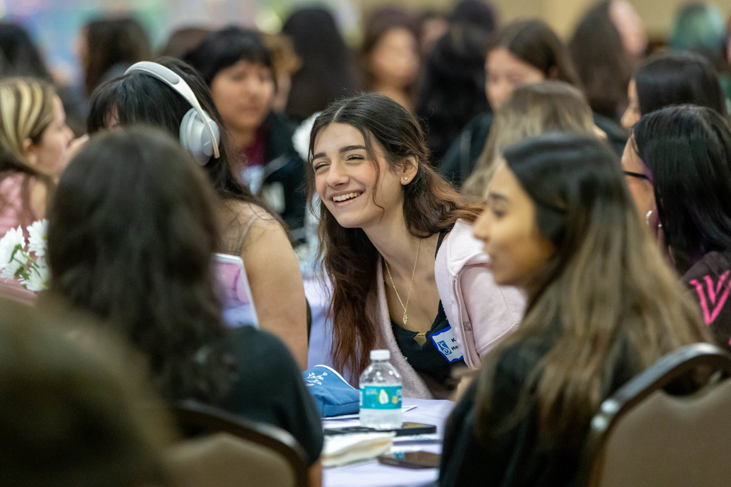 Students talking at a table
