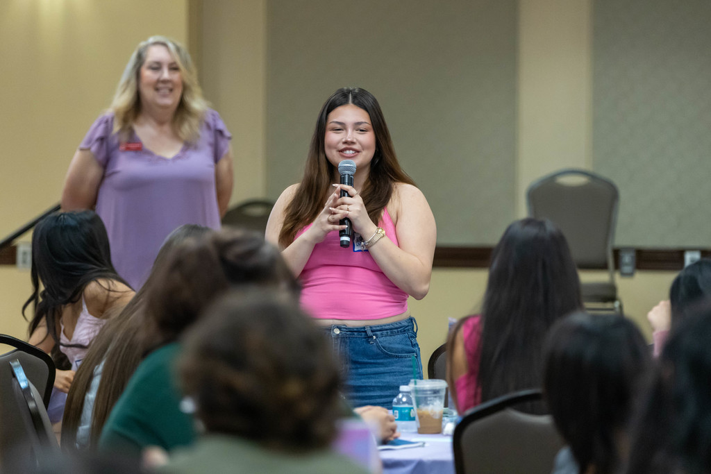Student talking to a crowd